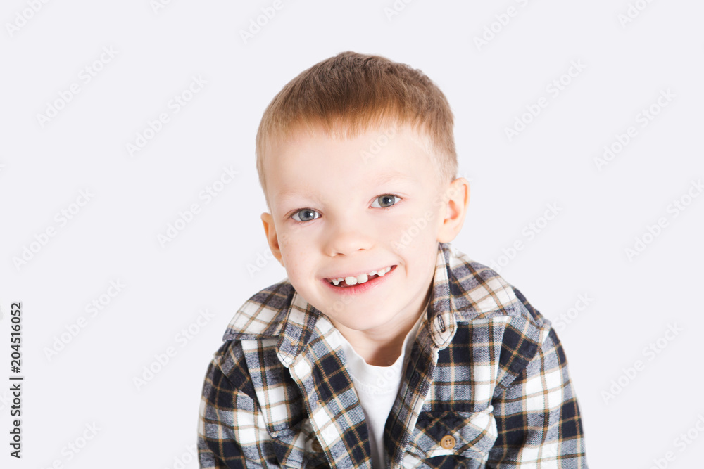 Portrait of happy joyful laughing beautiful little boy on white background
Portrait of happy joyful laughing beautiful little boy on white background
