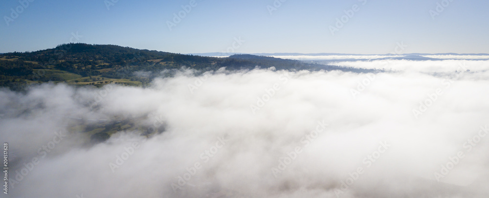 Obraz premium Aerial drone view of a foggy morning in the Scenic Rim, Queensland, Australia