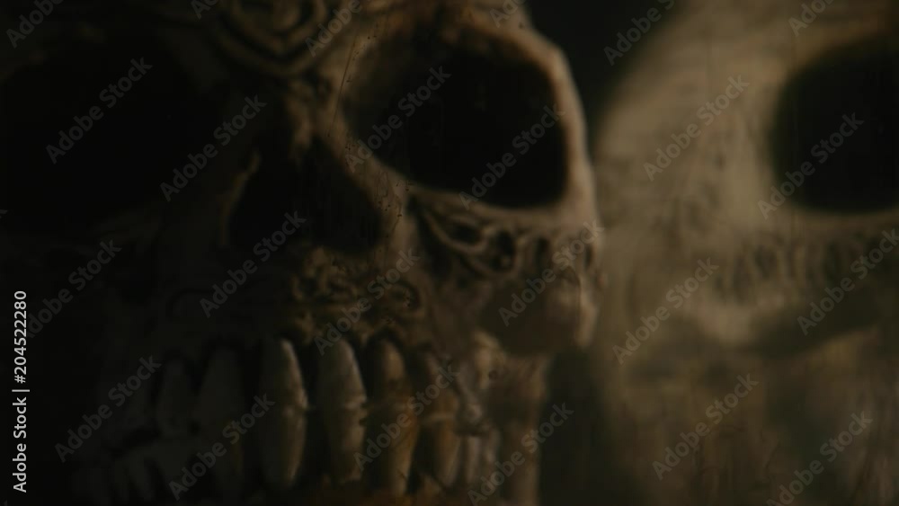 black ink in water with Skull on black background black ink in water with Skull on black background