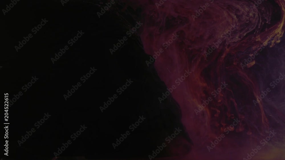 colored ink in water with Skull on black background colored ink in water with Skull on black background