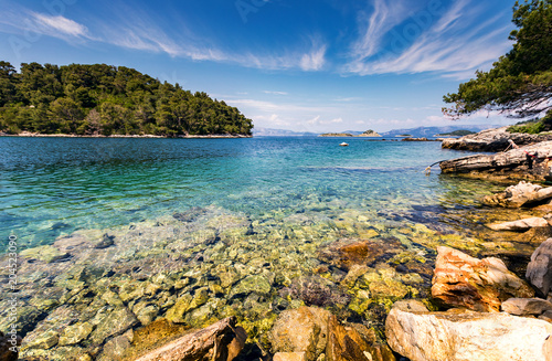 Beautiful view from the rocky coast to the azure sea.Landscape of rocky seashore with clear water of sea