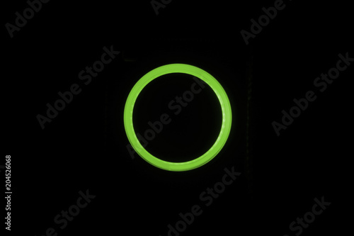 Green neon circle isolated on black background