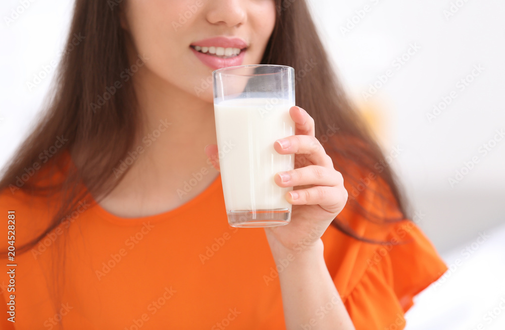 Beautiful young woman drinking milk, closeup Beautiful young woman drinking milk, closeup