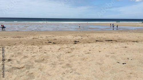 Golden Sand reaches down to the shore as the sun rises over an untouched beach (4K)