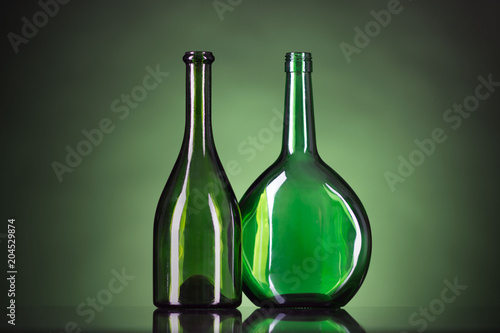 green bottles on a green background