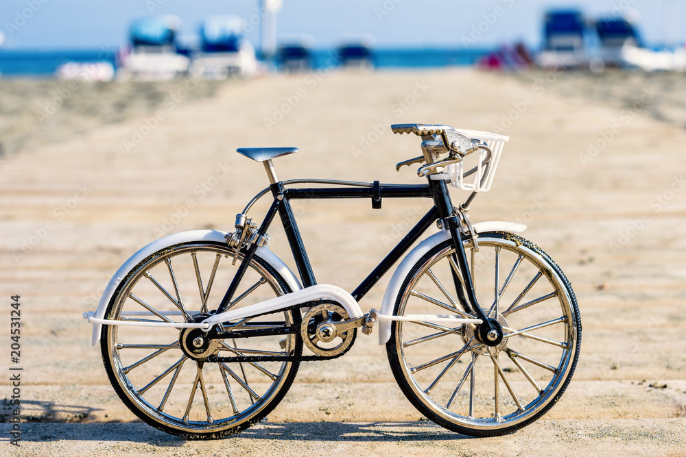 Daylight view to handicraft bicycle souvenir on wood pier