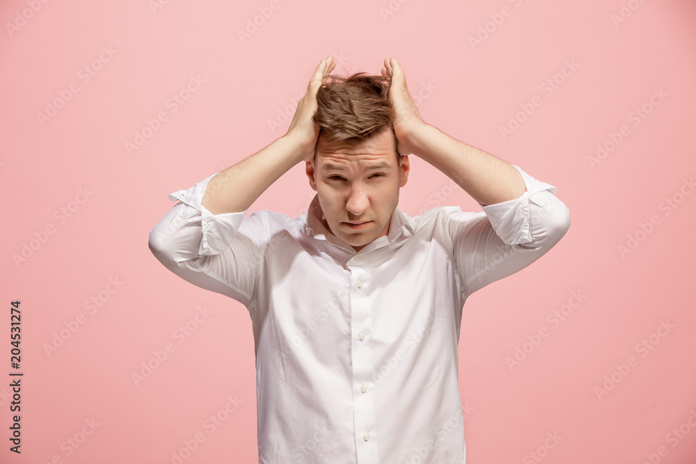 Man having headache. Isolated over pink background. Man having headache. Isolated over pink background.