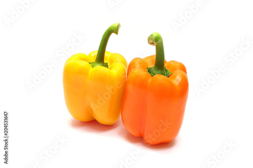 Colorful pepper isolated on wooden table 