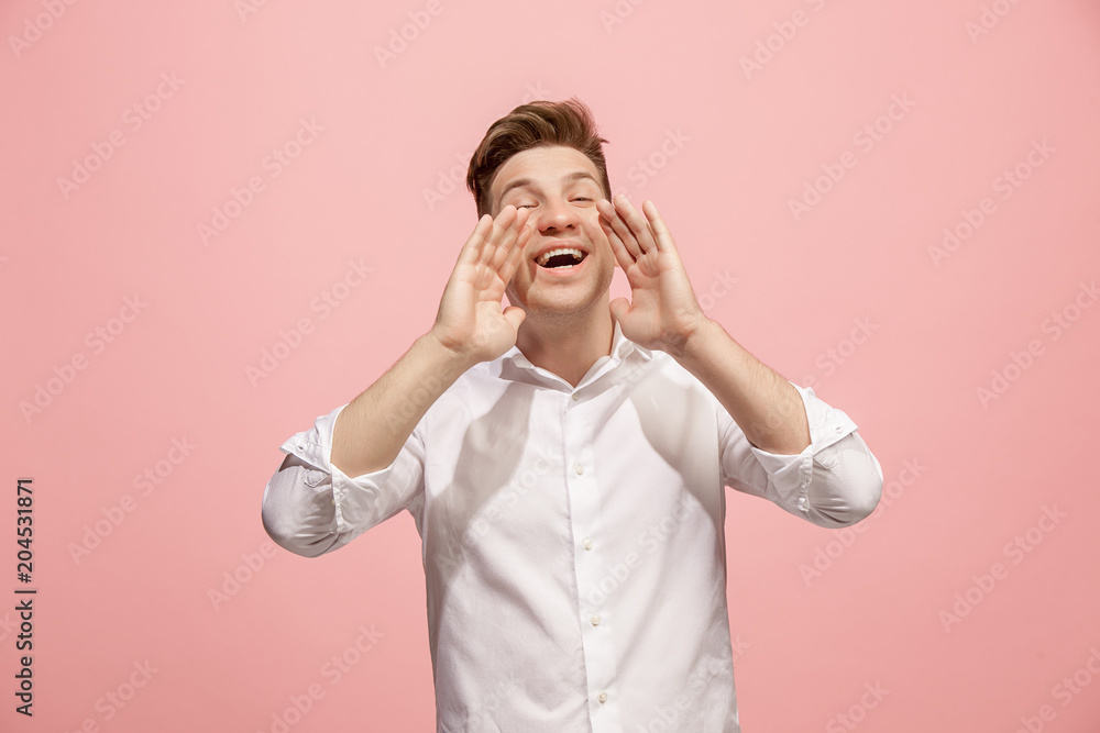 Isolated on pink young casual man shouting at studio Isolated on pink young casual man shouting at studio