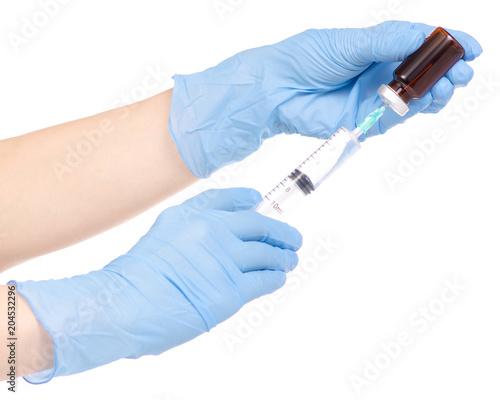 Syringe and medical ampoule in hand medical gloves