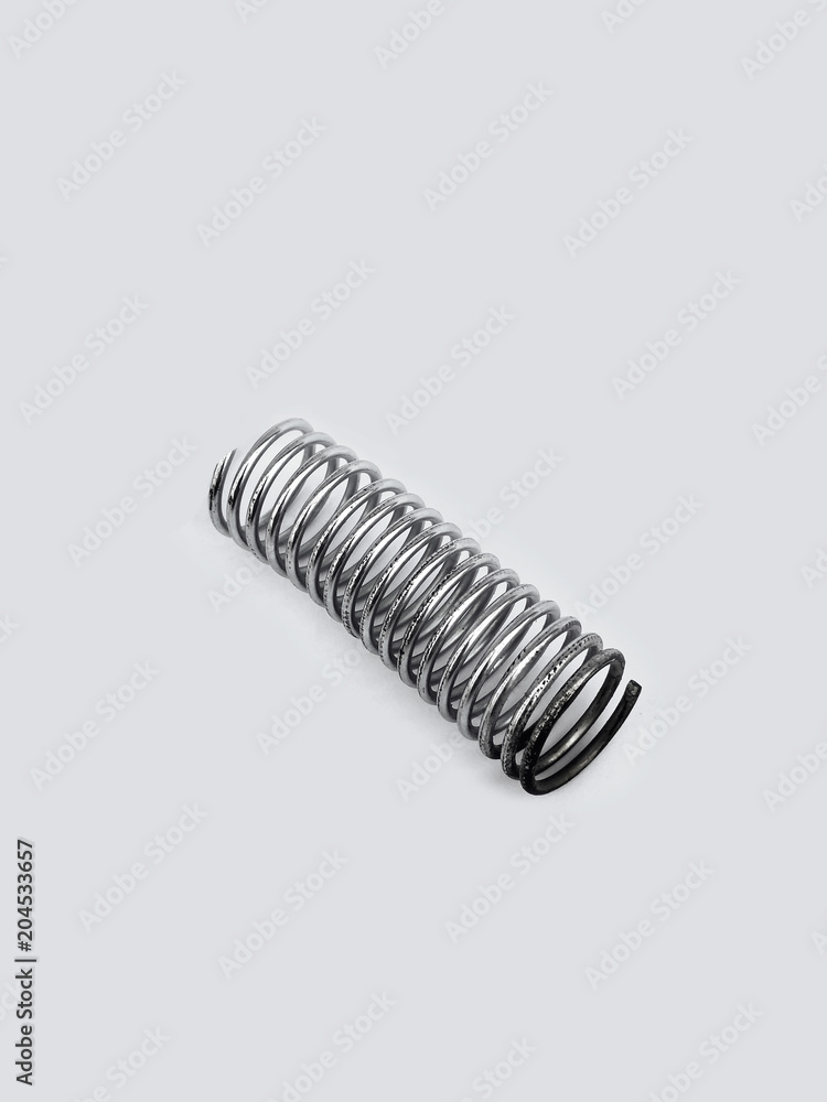 chrome metal spring over white background chrome metal spring over white background