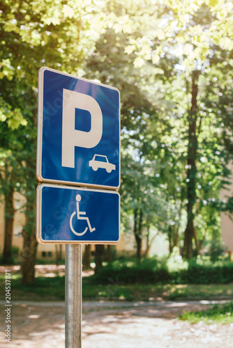 Disabled person parking spot sign, reserved lot space