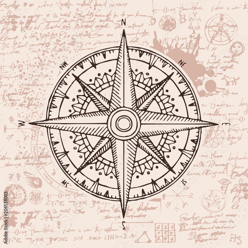 Hand-drawn vector banner with a wind rose and old nautical compass in retro style. Illustration on the theme of travel and discovery on the background of old manuscript