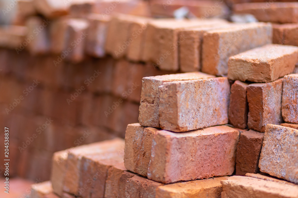 Red bricks on building. On blurred background Red bricks on building. On blurred background