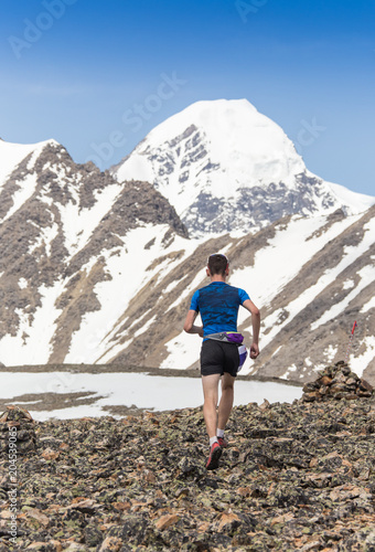 Trail runner, man and success in mountains. Running, sports