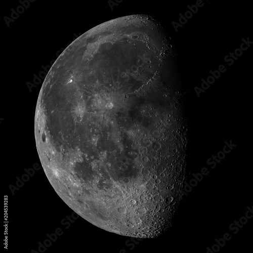 Very detaild moon with lots of craters photographed through a telescope.