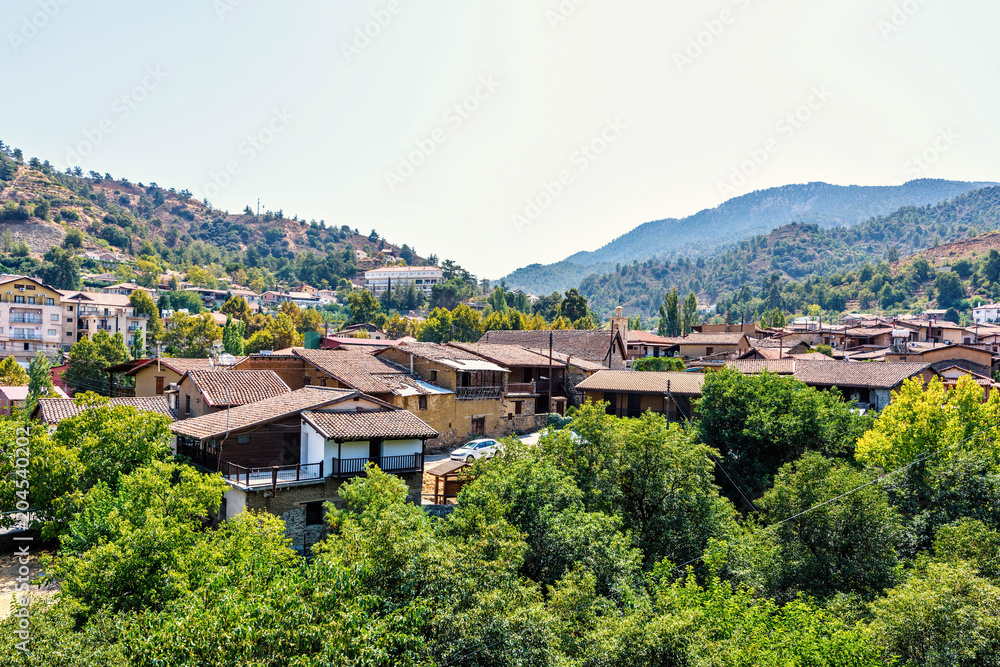 Daylight view from above to city buildings and Troodos Mountains