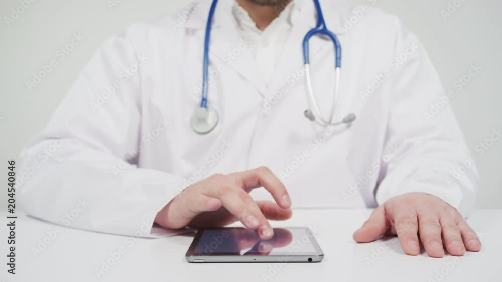 Doctor working on tablet Doctor working on tablet
