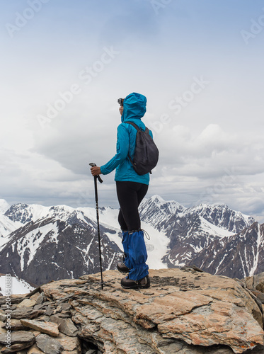happy woman standing in mountain