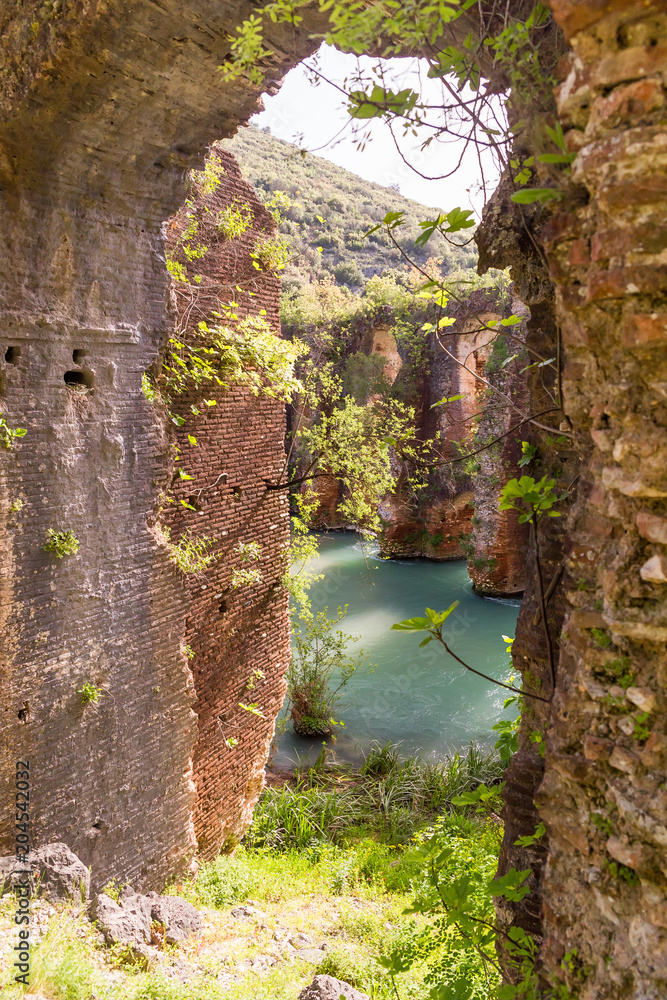 Fototapeta premium Roman aqueduct of ancient Nikopolis starts from the northern end of the valley of the Louros, near the village of St. George, north of Filippiada, Preveza, Greece