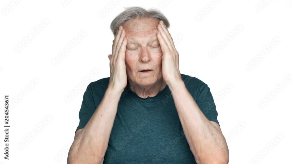 Portrait of unhealthy old aged man 80s having gray hair in basic t-shirt rubbing temples because of headache or sick, isolated over white background Portrait of unhealthy old aged man 80s having gray hair in basic t-shirt rubbing temples because of headache or sick, isolated over white background
