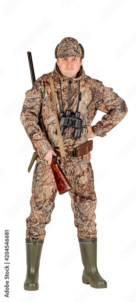 Obraz premium Full length portrait of a male hunter with double barreled shotgun Isolated on white background. hunting and people concept.