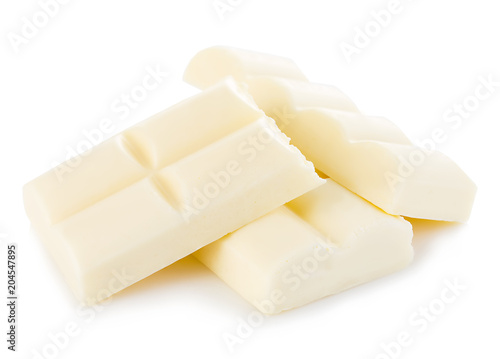 White chocolate pieces close-up isolated on a white background.