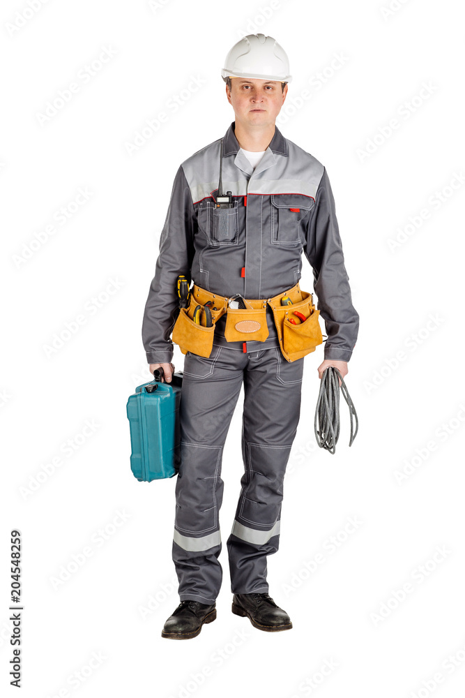 Male builder over white wall background. repair, construction, building, people and maintenance concept. Male builder over white wall background. repair, construction, building, people and maintenance concept.