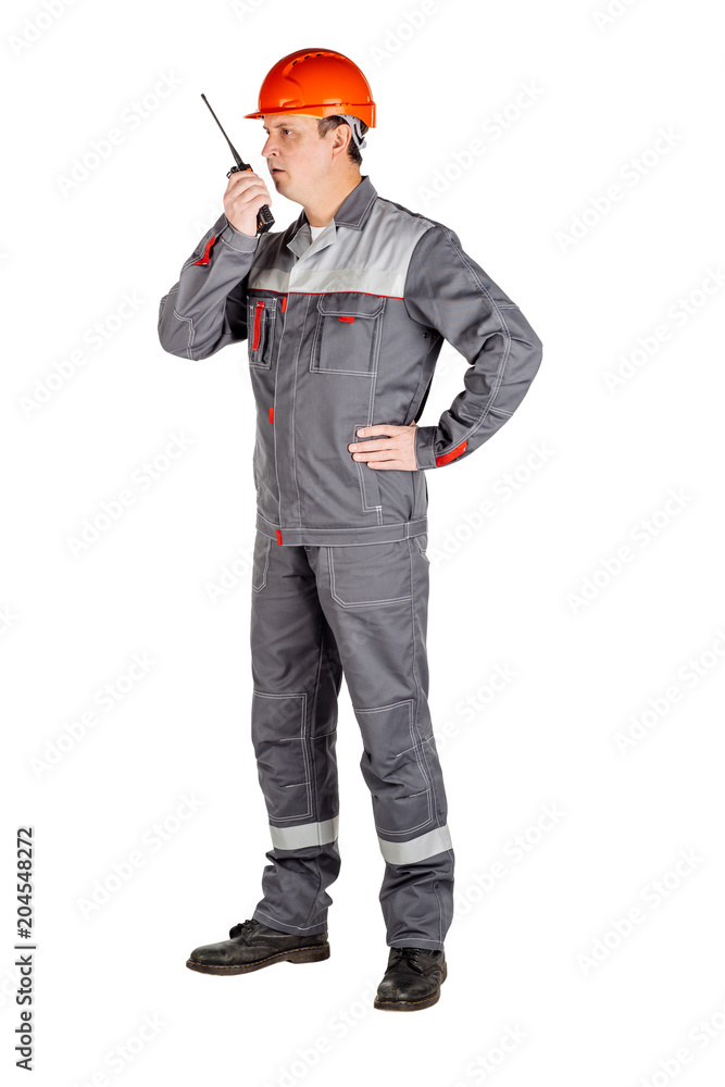 Male builder over white wall background. repair, construction, building, people and maintenance concept. Male builder over white wall background. repair, construction, building, people and maintenance concept.