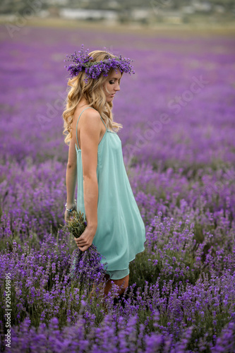 Fototapeta Naklejka Na Ścianę i Meble -  Beautiful girl on the lavender field