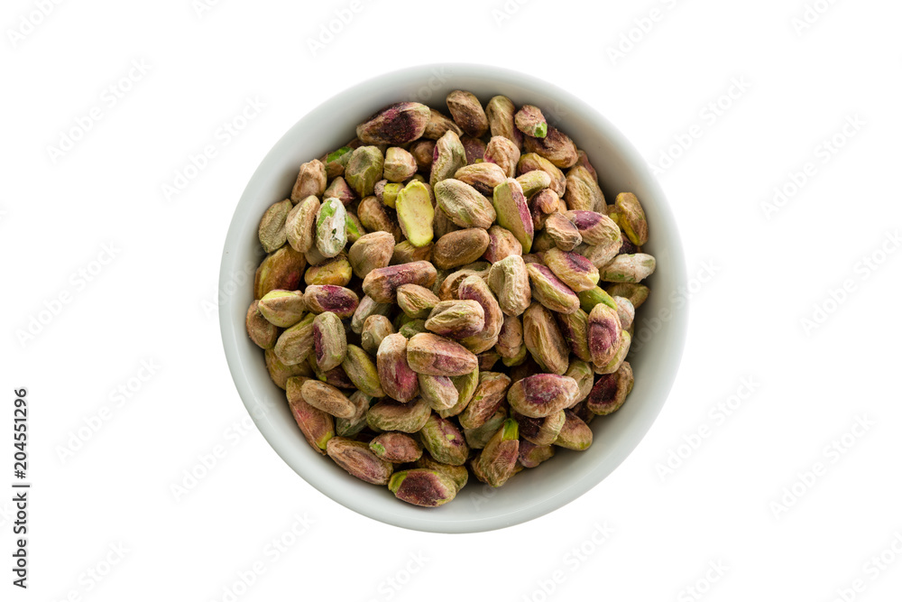 Shelled roasted fresh pistachio nuts in a bowl Shelled roasted fresh pistachio nuts in a bowl