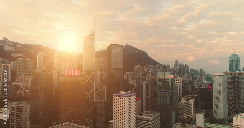 AERIAL. Hight speed flight between buildings at Hong Kong city.