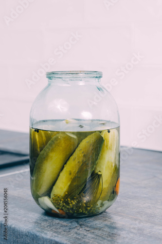 canned cucumbers in a glass jar.