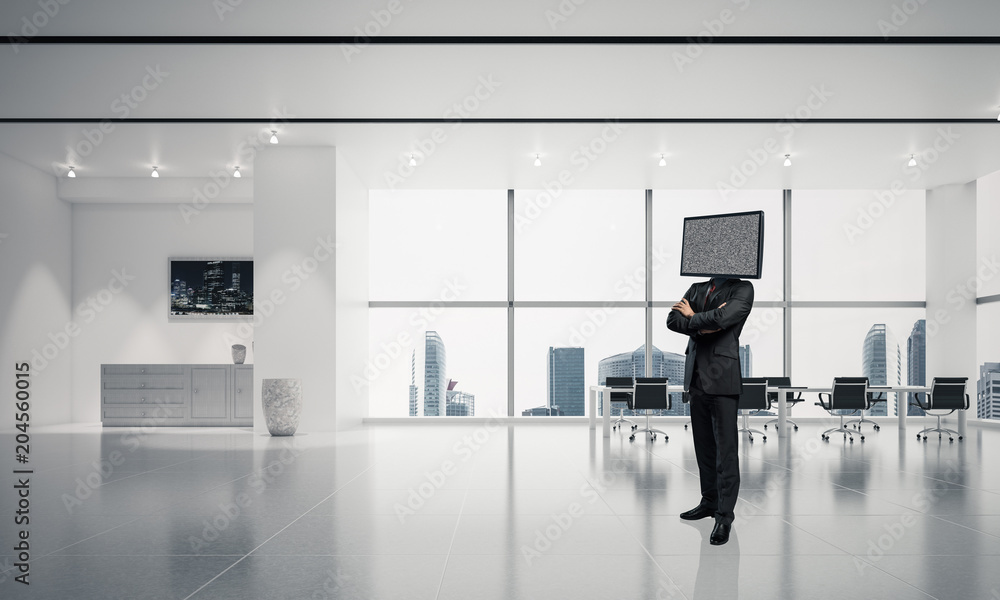 Fototapeta premium Businessman with TV instead of head.