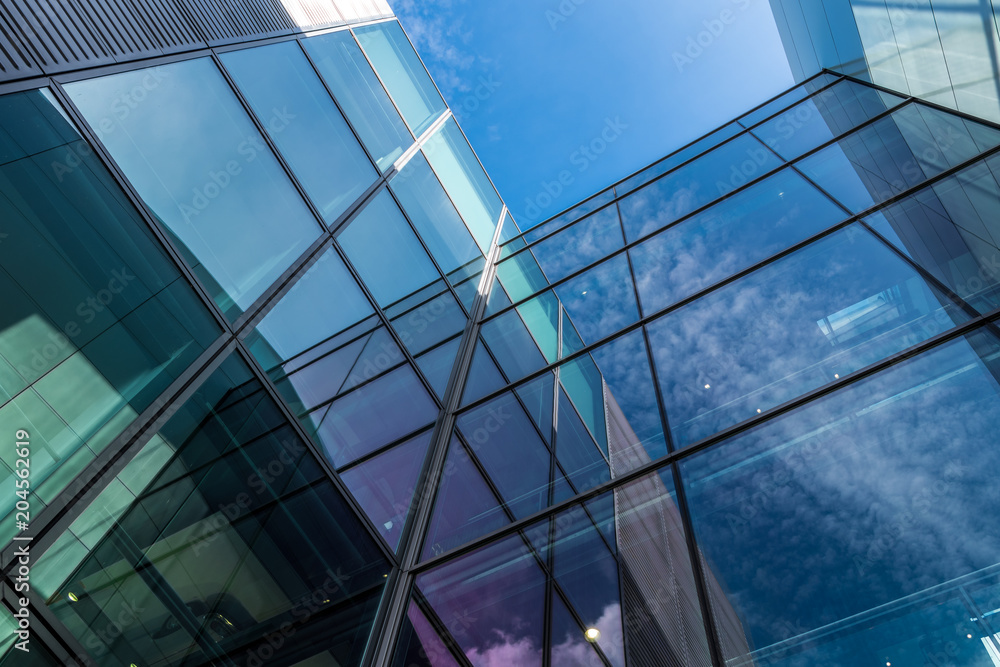 Obraz premium The glass architecture in city against a sky