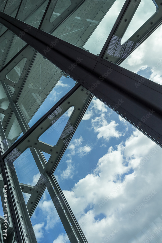 The glass architecture in city against a sky The glass architecture in city against a sky