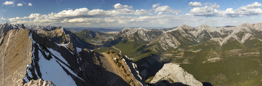Wide Panoramic Landscape of Front Range Mountains and distant Alberta Foothills from summit of Wasootch Peak in Kananaskis Country near Banff National Park in Canadian Rockies