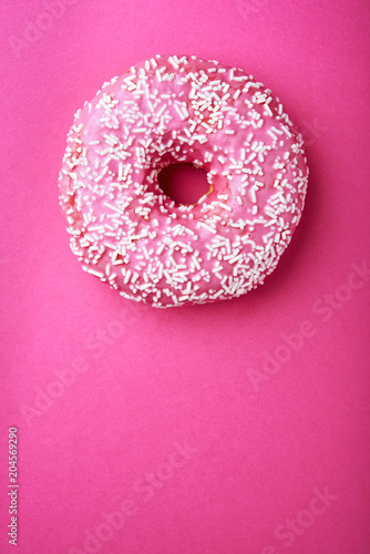 pink donut with white sprinkles
