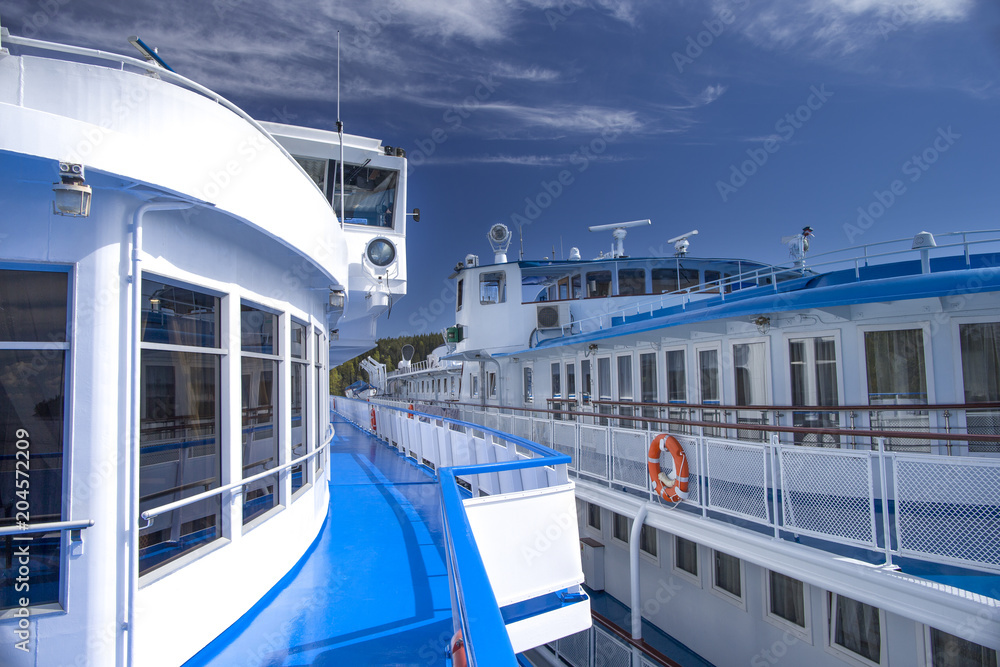 Naklejka premium A promenade deck of a passenger vessel moored at the berth