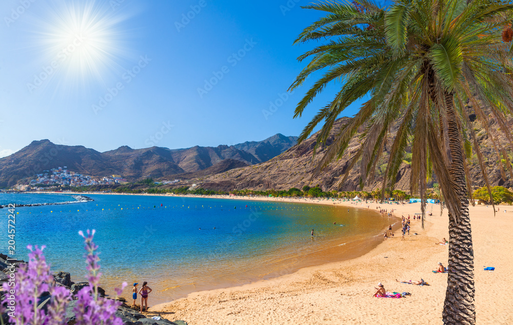 Idyllic beach holiday in Tenerife - Las Teresitas beach in a sunny day in summertime - Spain