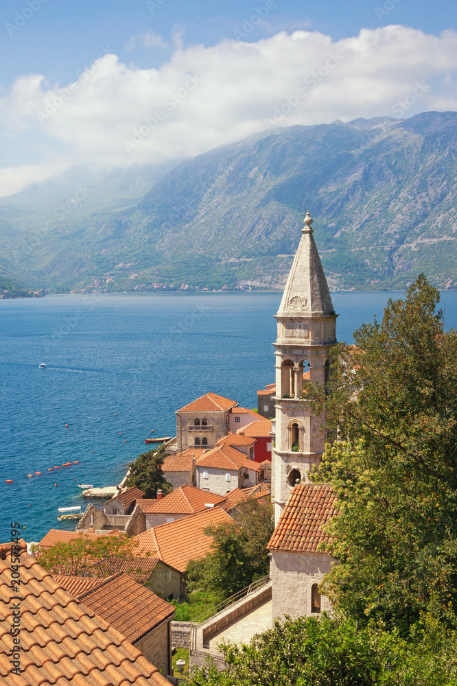 Beautiful Metiterranean landscape. Montenegro, Bay of Kotor. View of ancient town of Perast with  bell tower of Church of Our Lady of Rosary. Travel and tourism concept