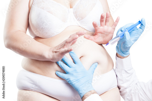 the full woman is afraid of an injection in the abdominal cavity