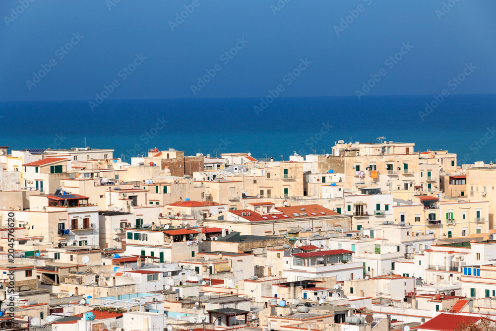 Italy, Foggia, Apulia, SE Italy, Gargano National Park,Vieste. Old  white washed-city, red tiled roofs.