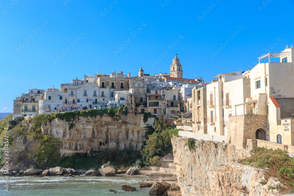Italy, Foggia, Apulia, SE Italy, Gargano National Park, old town Vieste. White-washed stone houses and church steeples. Coastline.