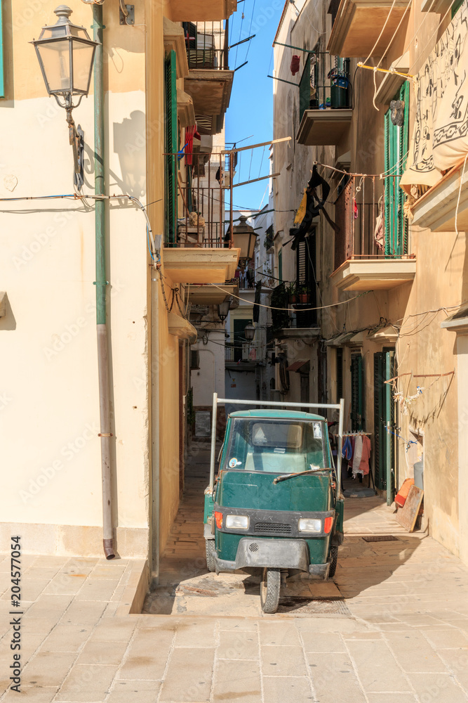 Italy, Foggia, Apulia, SE Italy, Gargano National Park, old - town Vieste. Narrow streets only allowing a 3 wheeled, motorized vehicle