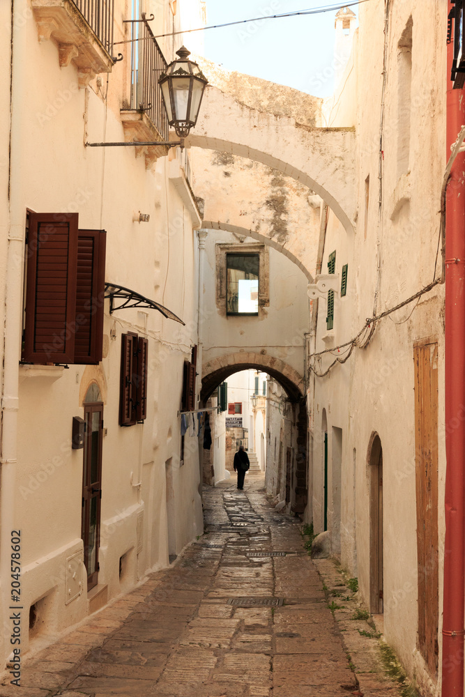 Italy, SE Italy, Ostuni. Narrow, arched old town . Red. Doorways.The 
