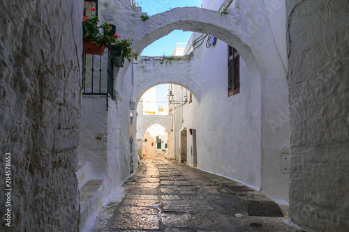 Italy  SE Italy  Ostuni. Narrow  arched old town . Cobblestone streets. Doorways.The  White City. 