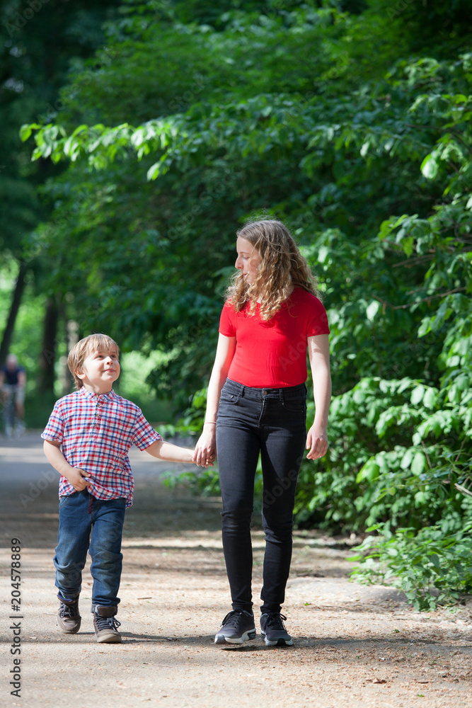 Brothers taking a walk in a park Brothers taking a walk in a park