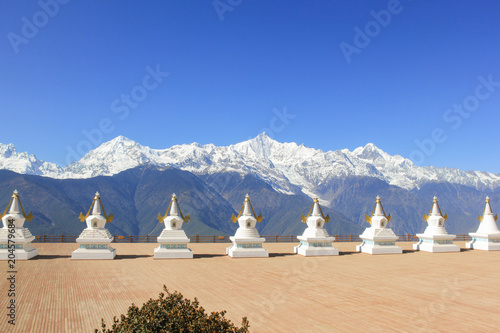 Holy white stupas by Feilai Temple overlooking the Meili Snow Mountain in Deqin, Yunnan province, China photo