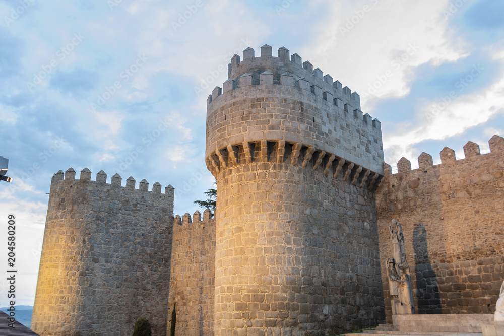 Tower of the wall of Avila at sunset. Spain.